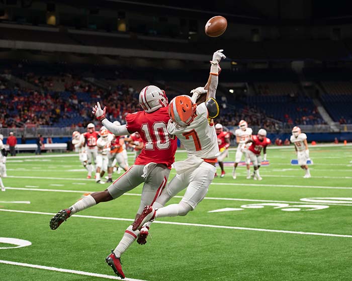 Great action photos of high school football player making amazing catch